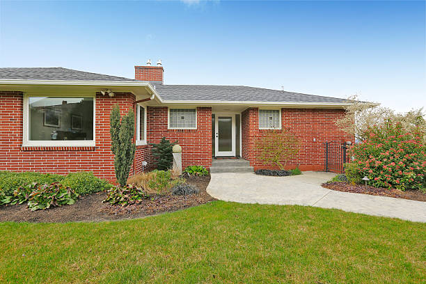 istock Red brick house with tile roof. Front view 546197432