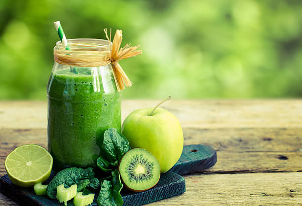 Healthy green smoothie in the jar stock photo