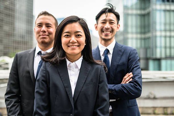 istock Business japanese team standing togetherness 546198650