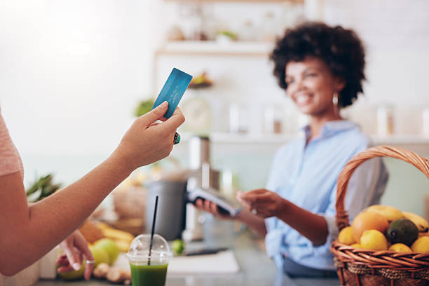 istock Customer paying for their order with a credit card 546198694