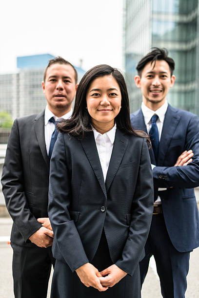 istock Business japanese team standing togetherness 546198796