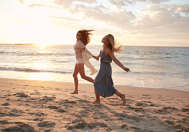 istock Friends enjoying a day on the beach 546199856