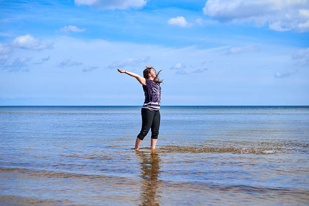 istock Happy young woman sprays water 546200932