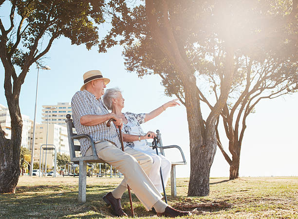 istock Retired couple taking a break and relaxing on a bench 546201016