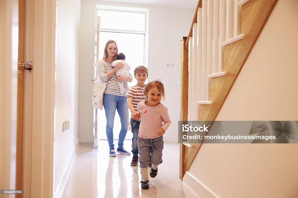 Young Family Looking Around Property For Sale Front Door Stock Photo