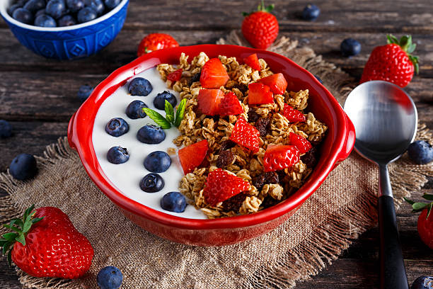 istock Homemade granola Breakfast with yogurt and fresh fruit berries. concepts 546204522