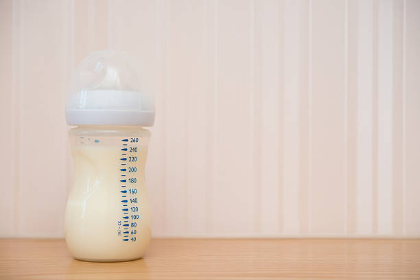 istock baby bottle of powdered milk at home with copy space 546204698
