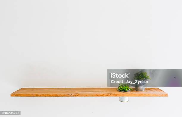 Wooden Shelf On White Wall With Green Plant Stock Photo - Download Image Now - Abstract, Arranging, Beauty In Nature