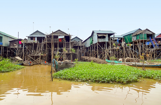 traditional settlement with wooden houses at the Tonle Sap river in Cambodia
