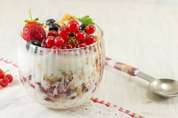 granola parfait with berry fruit and cream. - strawberry blueberry raspberry glass imagens e fotografias de stock