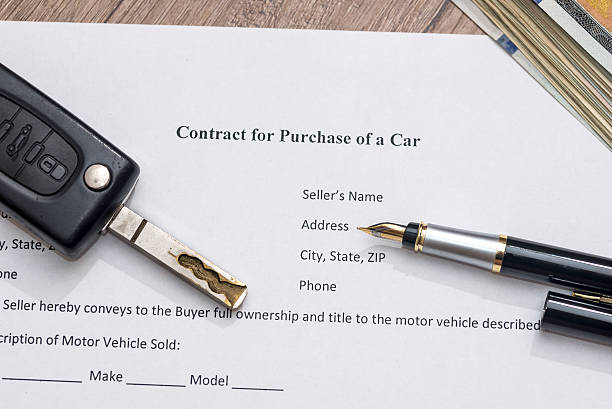 istock car contract form, pen and dollar 546208310