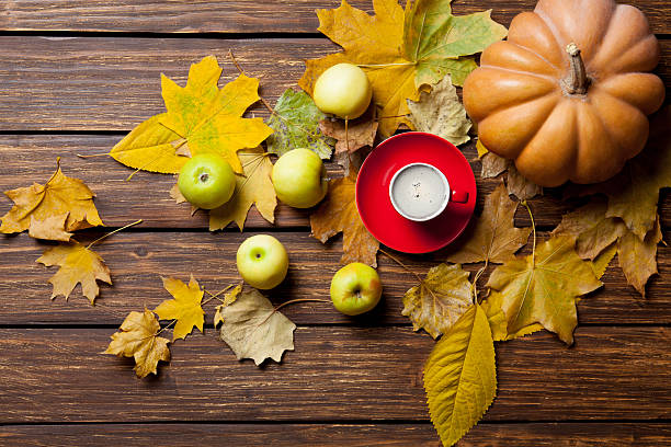 istock fallen leaves, pumpkin, apples and cup of coffee 546208346