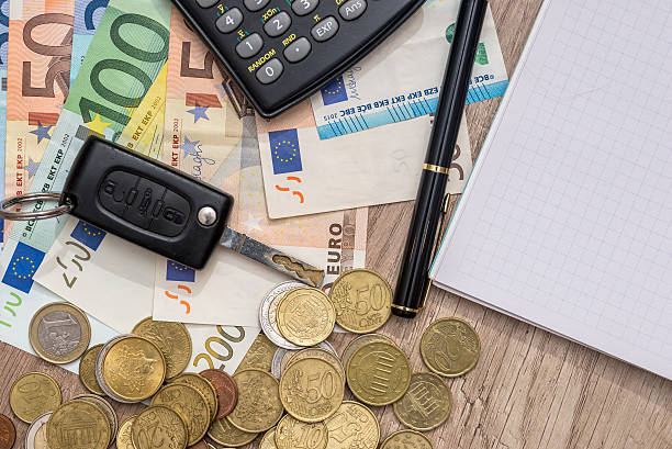 istock car key, euro banknotes, pen, coins and notebook 546208412