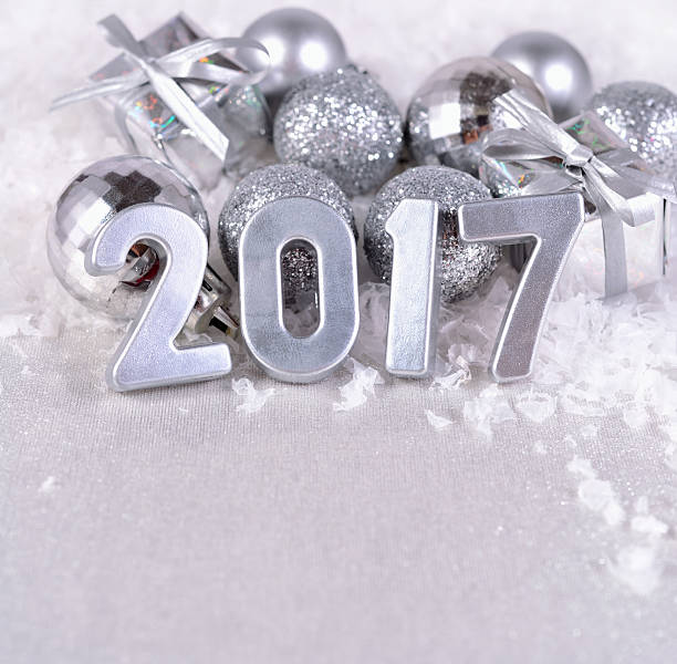 istock 2017 year silver figures and silvery Christmas decorations 546208510