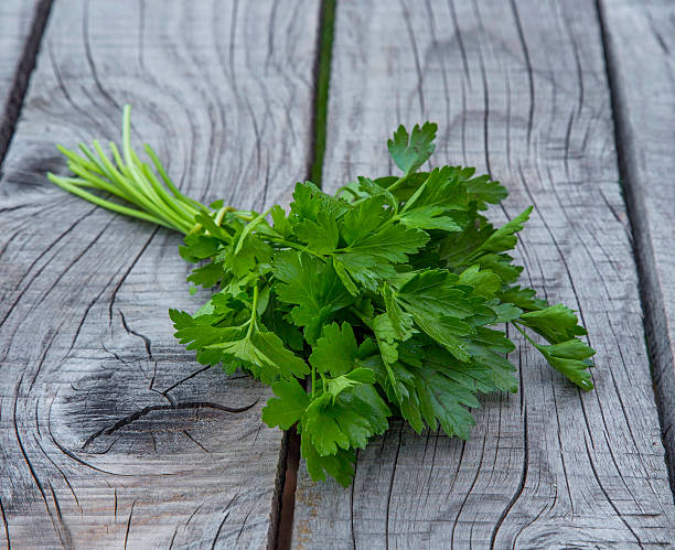 istock Parsley aromatic herb on wooden background 546209048