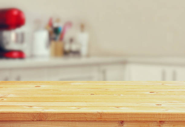 istock Wooden table in front of white retro kitchen background 546421736