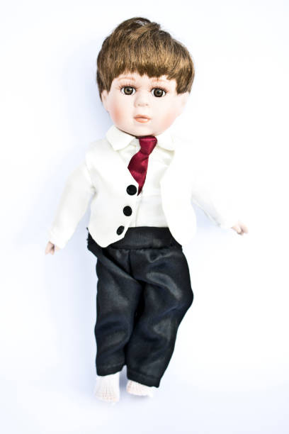 istock Boy Dolly in tuxedo on white background 546422106