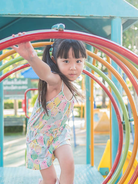 istock asian baby child playing on playground 546422774
