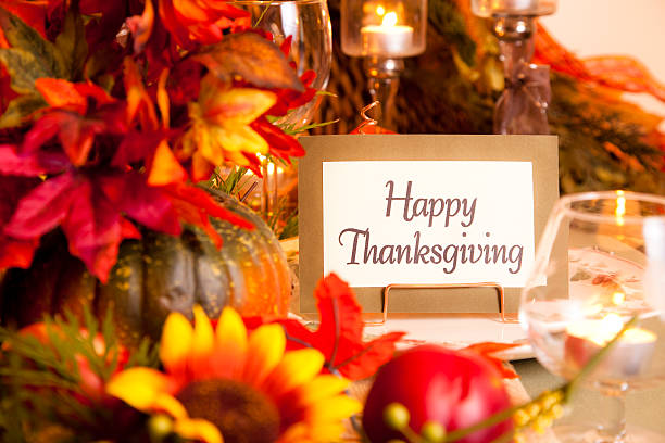 Happy Thanksgiving place setting. Autumn flower centerpiece. Table.