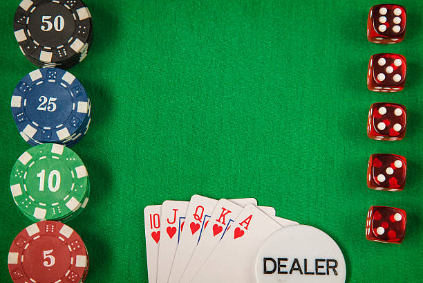 istock Gambling chips and poker card on green felt background 546424108