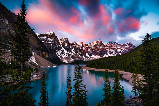 Moraine Lake in Banff, Alberta, Canada Dramatic Sunrise at Moraine Lake in Banff, Alberta, Canada moraine lake stock pictures, royalty-free photos & images