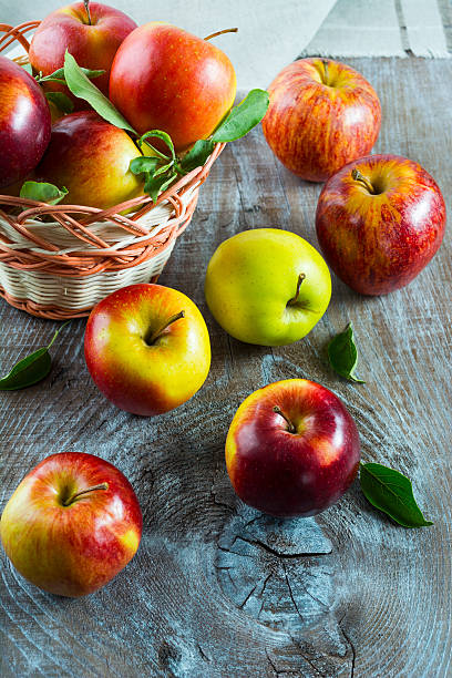 istock Fresh apples in the wicker basket on the rustic background 546424930