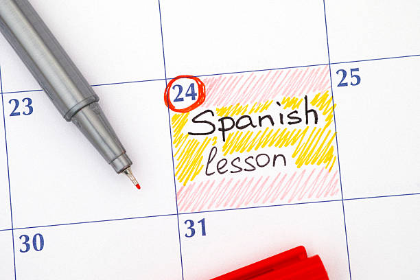 istock Reminder Spanish lesson in calendar with pen 546426998