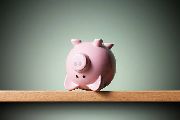 istock Piggy bank upside down 546428038