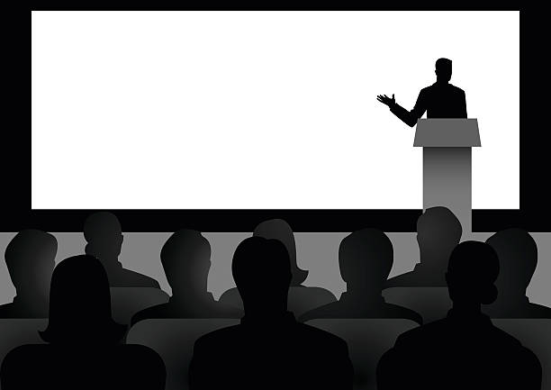 Man Giving A Speech On Stage Silhouette illustration of man figure giving a speech on stage with blank big screen as the background person presenting silhouette stock illustrations