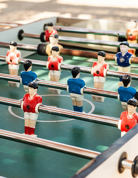 istock colored table football game with young players 546432342