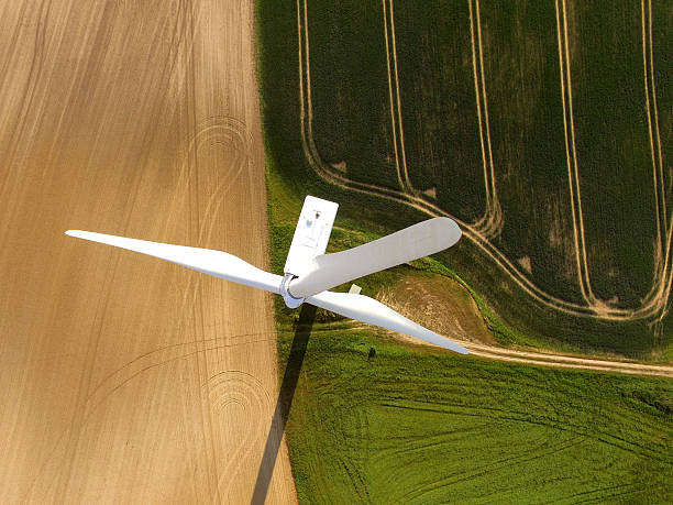 aerial view of a wind turbine in a agriculture field stock photo