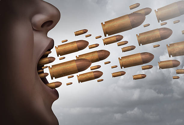 Fight With Words Fight with words social issue concept as a person screaming with bullets flying out of the mouth as a metaphor for strong communication and aggressive shouting with 3D illustration elements. furious stock pictures, royalty-free photos & images