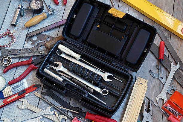 istock Tool box on wooden floor, view from above. 546436960
