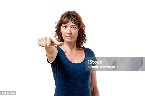 Middleaged Woman Abstaining From Voting Stock Photo - Download Image Now - Adult, Beige, Brown Hair