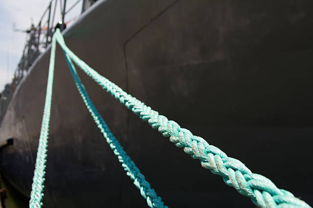 istock mooring rope holding the ship at the pier 546437404