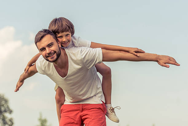 istock Dad and son resting outdoors 546437816