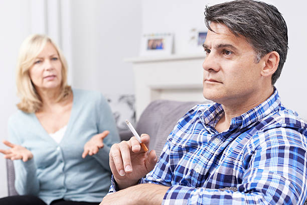 istock Mature Couple Arguing Over Smoking At Home 546441534