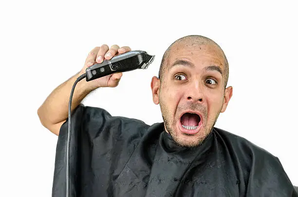 Photo of Man holds the trimming machine and beautify yourself