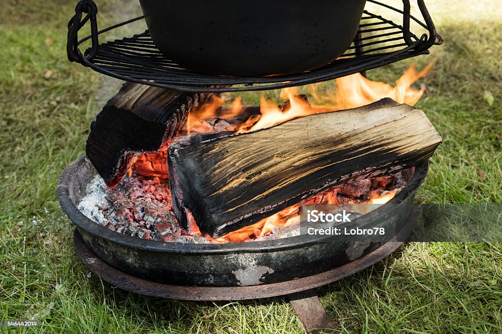 Big Cooking Pot Placed On Fire In A Camping Outdoors Stock Photo