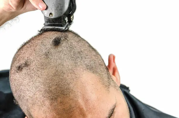 Photo of Man holds the trimming machine and beautify yourself