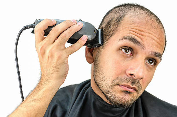 istock Man holds the trimming machine and beautify yourself 546442346