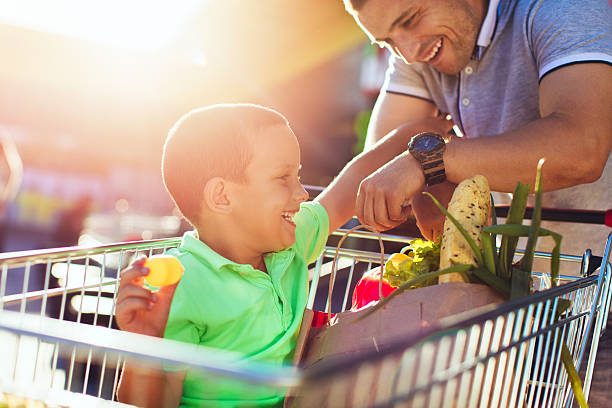 istock Father and son in a grocery shopping 546442462