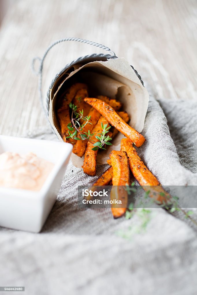 Sweet potato fries Fresh homemade sweet potato fries with thyme French Fries Stock Photo