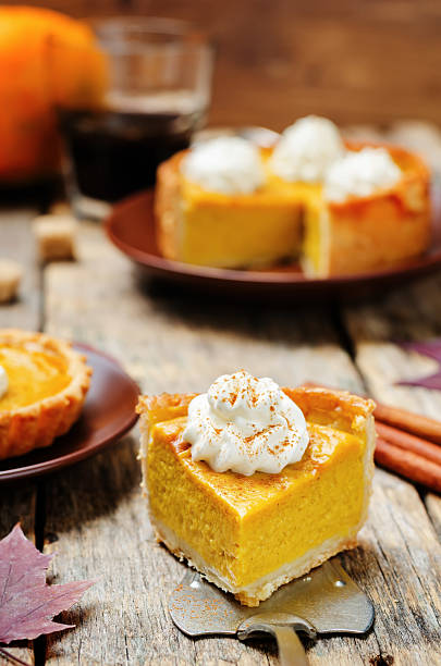 istock pumpkin pie decorated with whipped cream 546442738