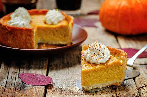 istock pumpkin pie decorated with whipped cream 546442768