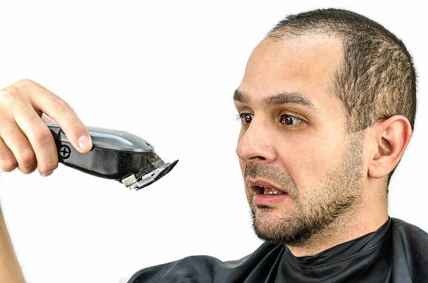 Man holds the trimming machine and beautify yourself