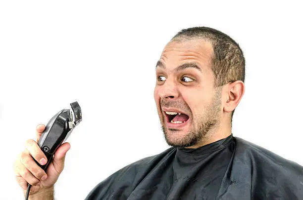 Photo of Man holds the trimming machine and beautify yourself