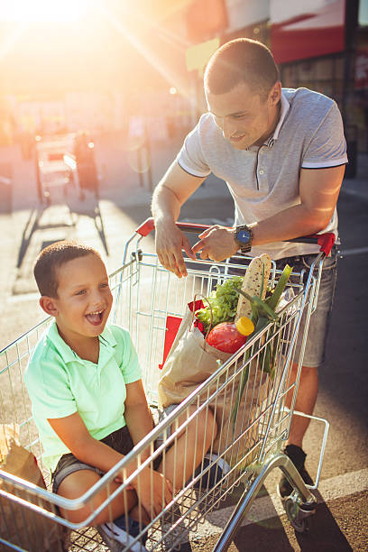 istock Father and son in a grocery shopping 546443088