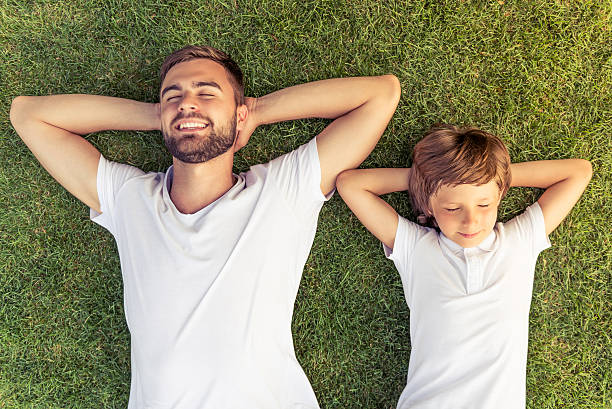 istock Dad and son resting outdoors 546443390