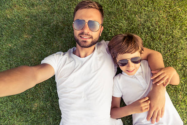 istock Dad and son resting outdoors 546443542